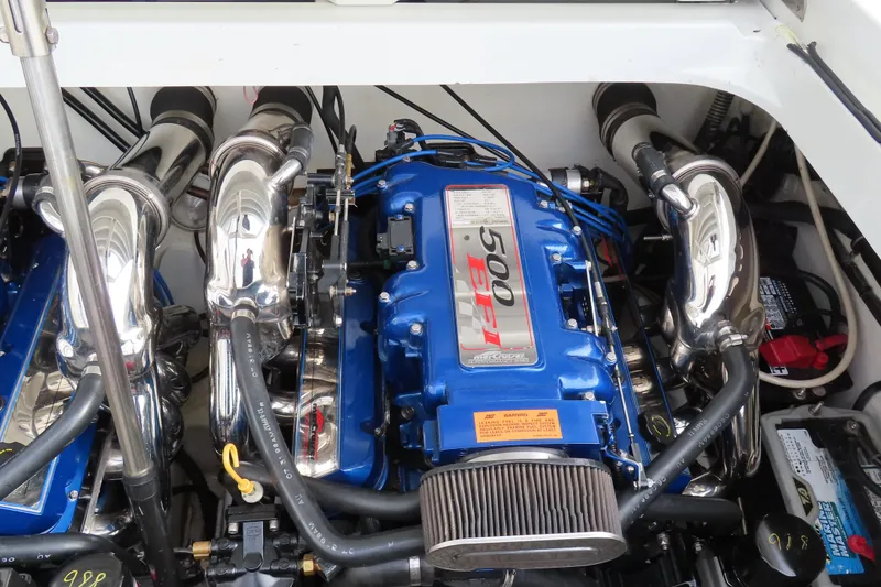 Slide: The Image of 1999 Formula 382 FASTech engine compartment with blue 500 EFI engine and chrome components. - 12