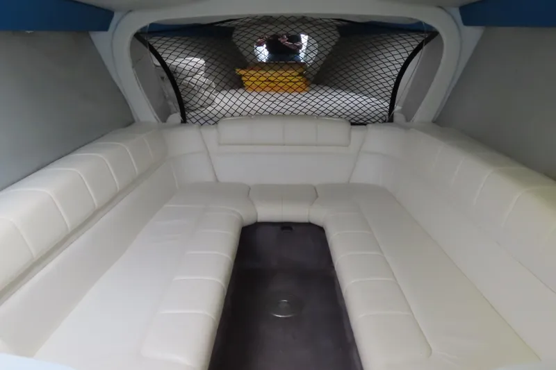 Slide: The Image of Interior of 1999 Formula 382 FASTech boat with white leather seating. - 15