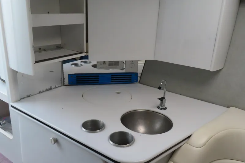 Slide: The Image of Interior of 1999 Formula 382 FASTech boat with compact kitchenette and sink. - 19
