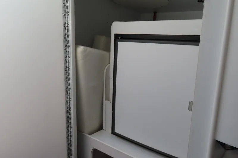 Slide: The Image of 1999 Formula 382 FASTech interior storage compartment with white cabinetry. - 20