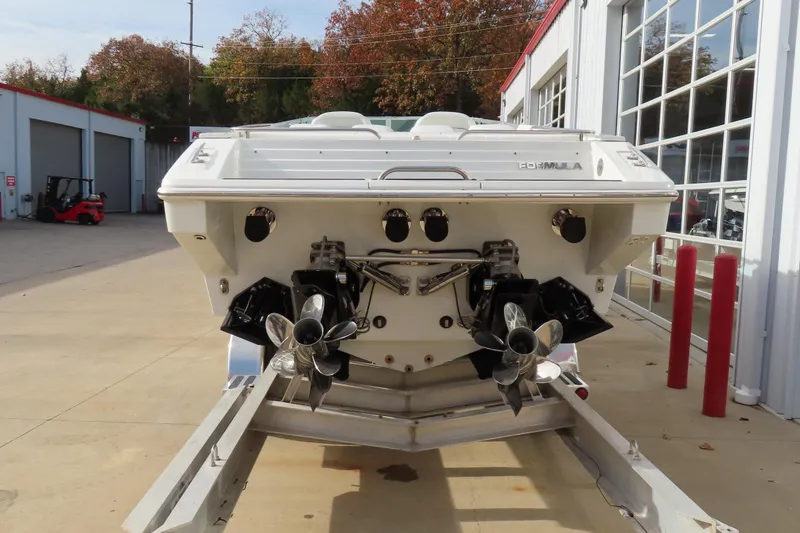 Slide: The Image of 1999 Formula 382 FASTech boat on trailer, rear view with dual propellers. - 4