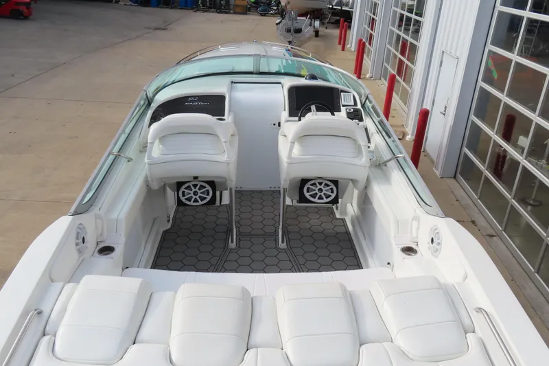 Slide: The Image of 1999 Formula 382 FASTech boat interior with white seating and modern dashboard. - 6