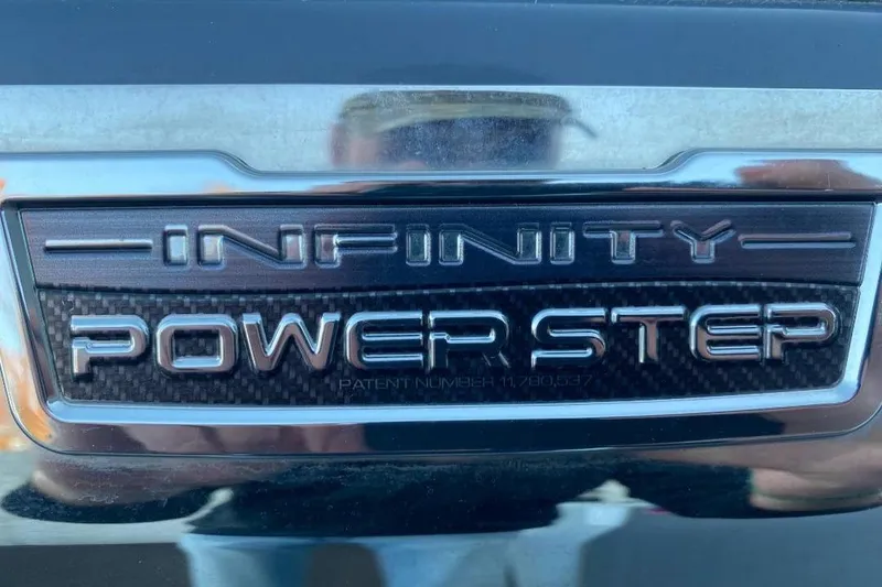 Slide: The Image of Infinity Power Step badge on 2024 Chaparral 307 SSX boat. - 6