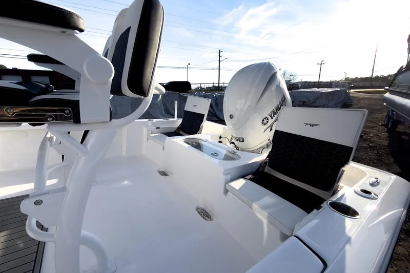 Slide: The Image of 2026 Tidewater 2110 Bay Max boat interior with Yamaha engine, featuring seating and storage. - 12