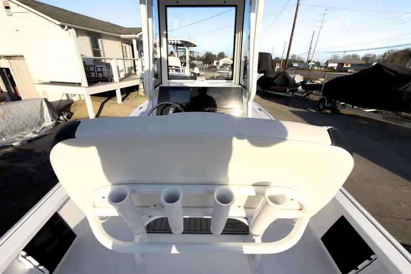 Slide: The Image of 2026 Tidewater 2110 Bay Max boat interior with rod holders and console view. - 18