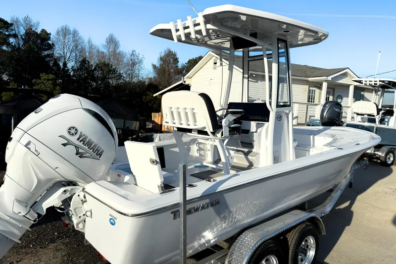 Slide: The Image of 2026 Tidewater 2110 Bay Max boat with Yamaha engine on trailer. - 2