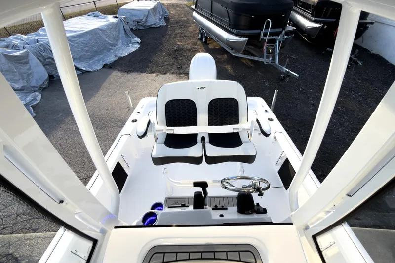 Slide: The Image of 2026 Tidewater 2110 Bay Max boat interior with dual seats and steering wheel. - 20