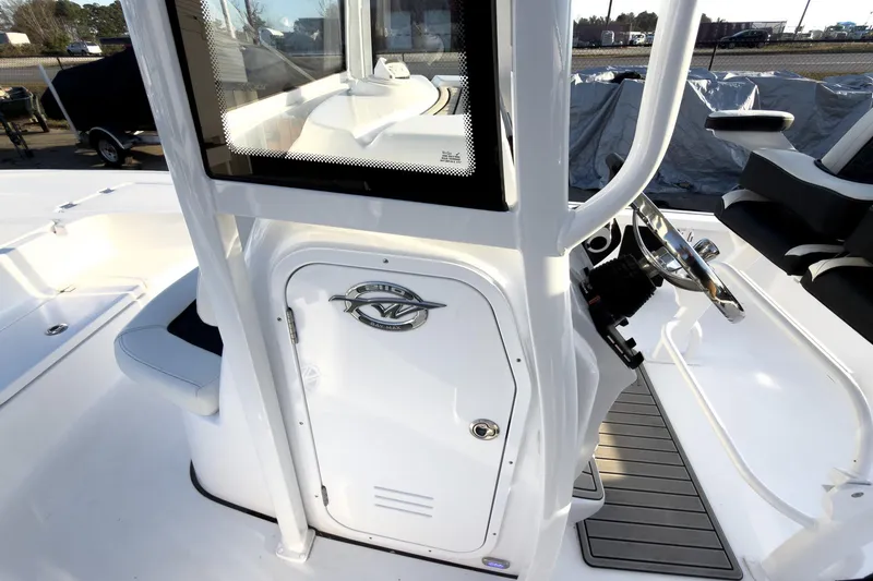 Slide: The Image of 2026 Tidewater 2110 Bay Max boat interior with steering console and seating. - 27