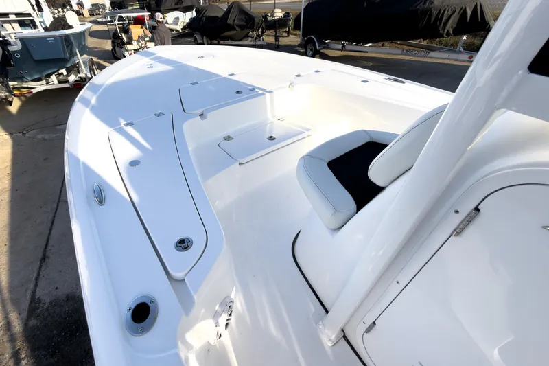 Slide: The Image of 2026 Tidewater 2110 Bay Max boat interior with seating and storage compartments. - 32