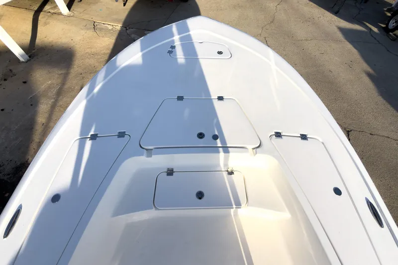 Slide: The Image of 2026 Tidewater 2110 Bay Max boat deck with storage compartments. - 33