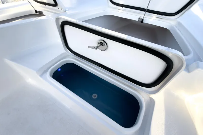 Slide: The Image of Open storage compartment on 2026 Tidewater 2110 Bay Max boat. - 35