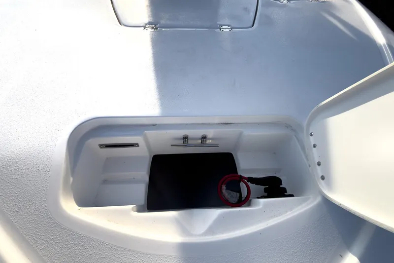 Slide: The Image of 2026 Tidewater 2110 Bay Max storage compartment with open hatch, showcasing interior details. - 37
