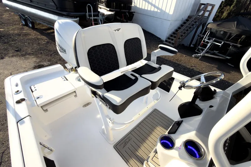Slide: The Image of 2026 Tidewater 2110 Bay Max boat interior with dual seating and steering console. - 8