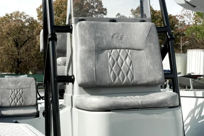 Slide: The Image of 2026 G3 Bay 19 GX boat with gray cushioned seating and sleek design. - 11