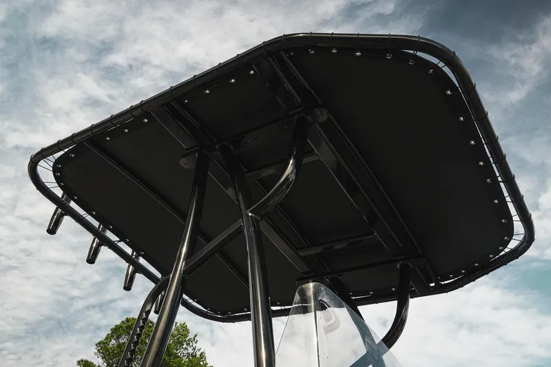 Slide: The Image of 2026 G3 Bay 19 GX boat canopy against a cloudy sky. - 12