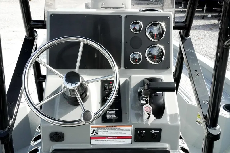 Slide: The Image of Steering console of 2026 G3 Bay 19 GX boat with gauges and controls. - 16