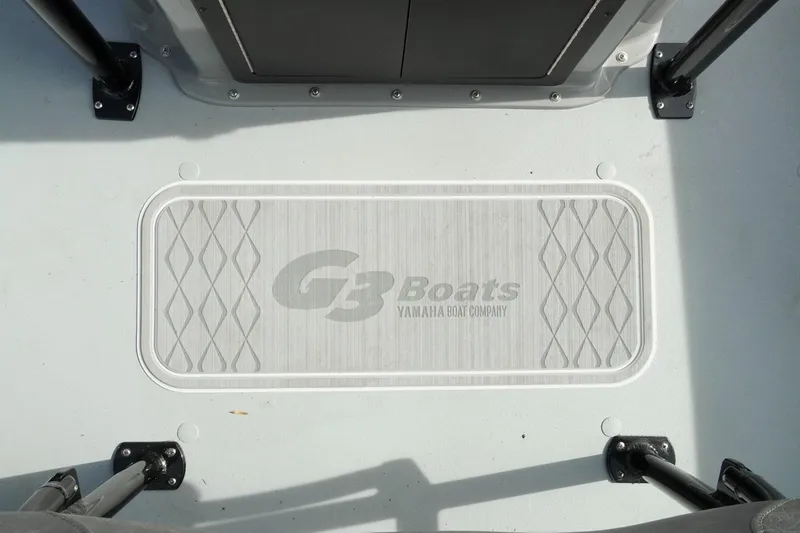 Slide: The Image of 2026 G3 Bay 19 GX boat deck with logo and textured surface. - 20