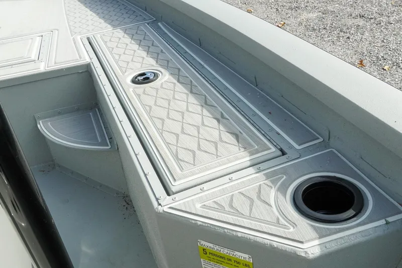Slide: The Image of 2026 G3 Bay 19 GX boat interior with textured deck and storage compartments. - 21