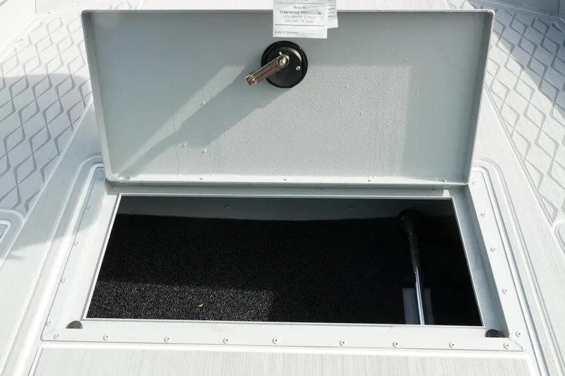 Slide: The Image of Open storage compartment on 2026 G3 Bay 19 GX boat deck. - 24