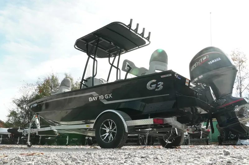 Slide: The Image of 2026 G3 Bay 19 GX boat with Yamaha engine on trailer, outdoor setting. - 29