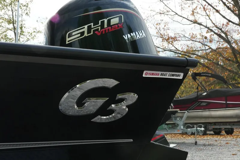 Slide: The Image of 2026 G3 Bay 19 GX boat with Yamaha SHO VMAX engine, parked outdoors. - 30