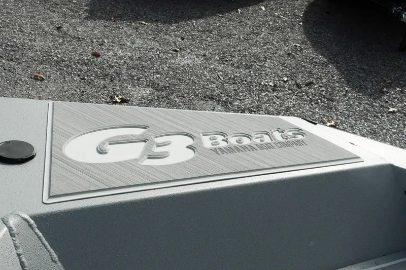Slide: The Image of 2026 G3 Bay 19 GX boat logo on textured surface. - 31