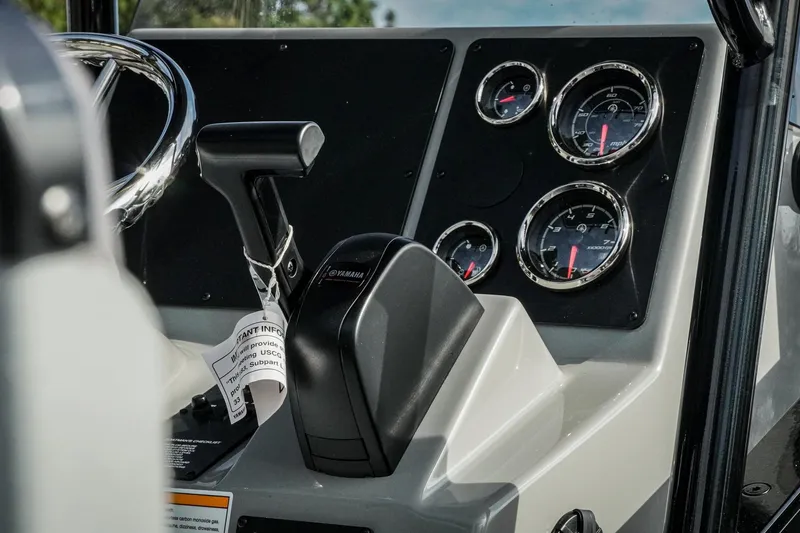 Slide: The Image of Control panel of 2026 G3 Bay 19 GX boat with Yamaha throttle and gauges. - 8