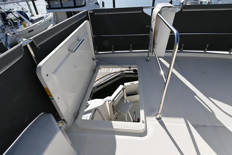Slide: The Image of 2023 Beneteau Swift Trawler 35 deck with open hatch and railing. - 18