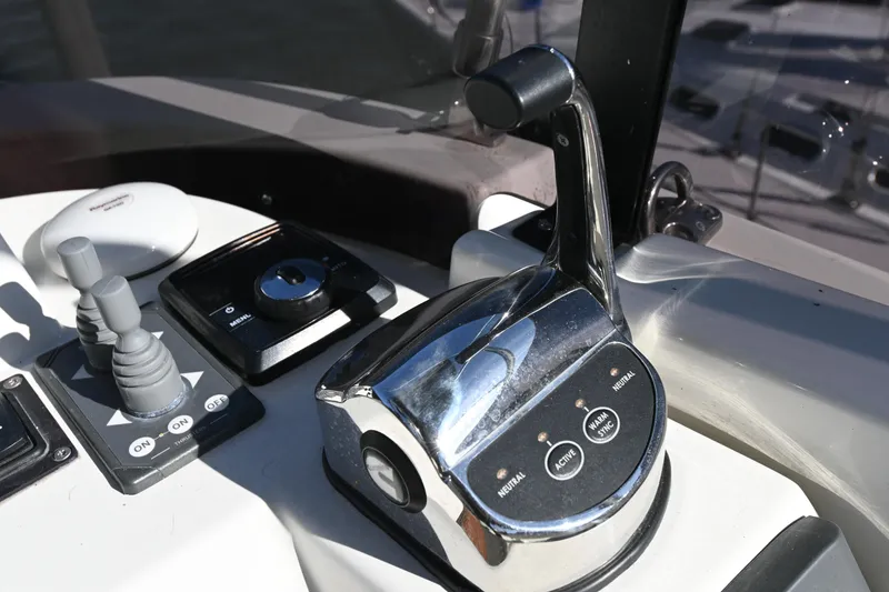 Slide: The Image of Control panel of 2023 Beneteau Swift Trawler 35 with throttle and joystick. - 28