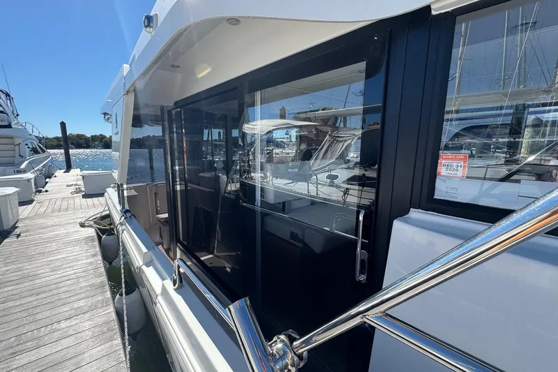 Slide: The Image of 2023 Beneteau Swift Trawler 35 docked, showcasing sleek design and modern features. - 33