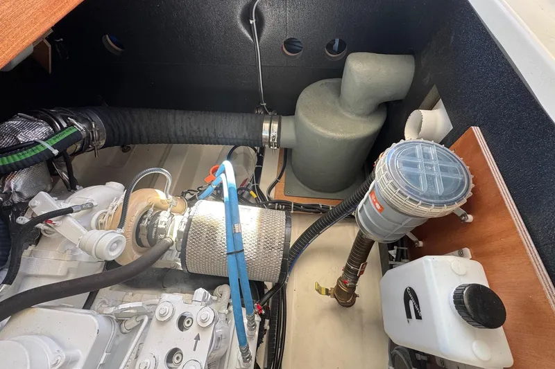 Slide: The Image of Engine room of 2023 Beneteau Swift Trawler 35, showcasing mechanical components and systems. - 58