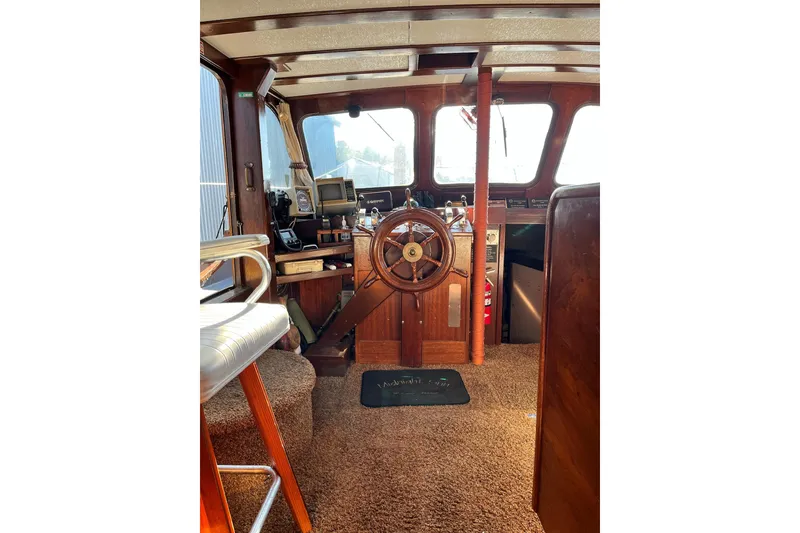 Slide: The Image of 1943 Shain-Monk 50 Twin Engine Classic Bridgedeck Cruiser interior with wooden helm and vintage controls. - 13