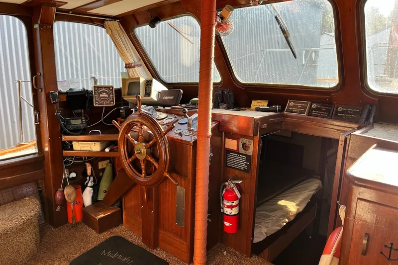 Slide: The Image of Interior of 1943 Shain-Monk 50 Twin Engine Classic Bridgedeck Cruiser with wooden helm and navigation equipment. - 15