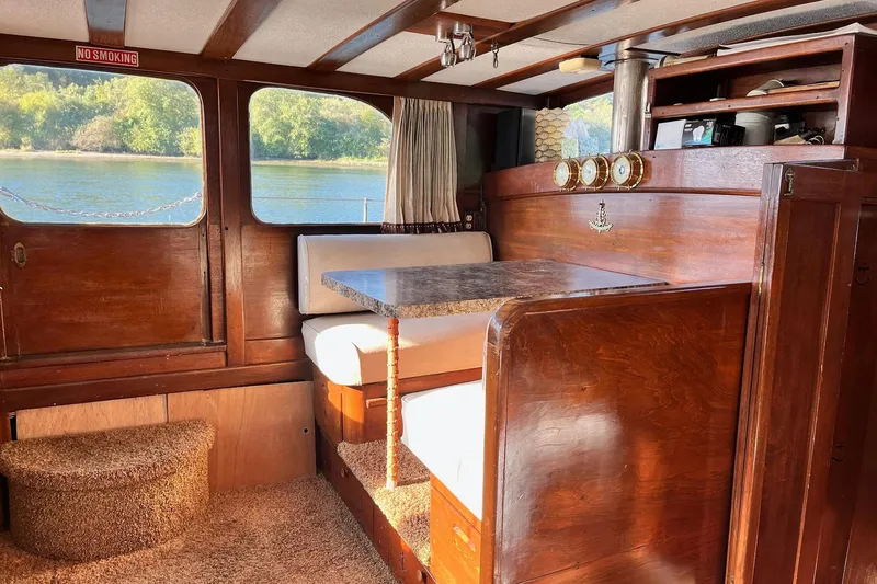 Slide: The Image of Interior of 1943 Shain-Monk 50 Twin Engine Classic Bridgedeck Cruiser with wood paneling and seating. - 18