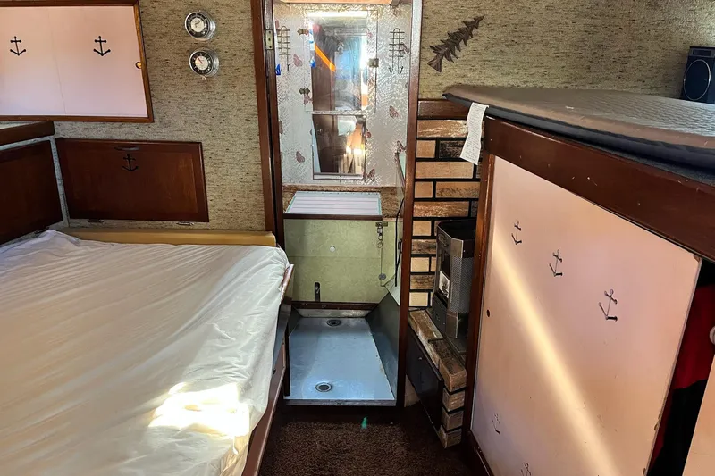 Slide: The Image of Interior of 1943 Shain-Monk 50 Twin Engine Classic Bridgedeck Cruiser with bed and nautical decor. - 19