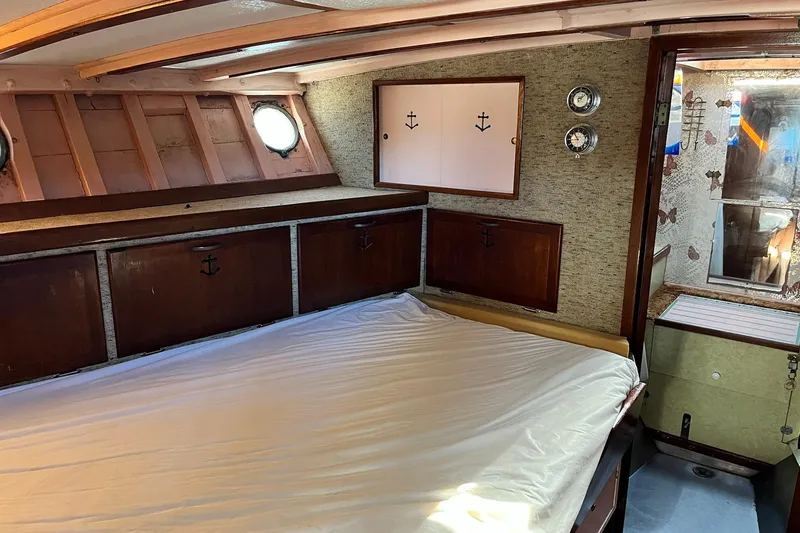 Slide: The Image of 1943 Shain-Monk 50 Twin Engine Cruiser cabin with wooden accents and nautical decor. - 20