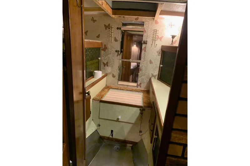 Slide: The Image of 1943 Shain-Monk cruiser interior with butterfly wallpaper and wooden accents. - 21