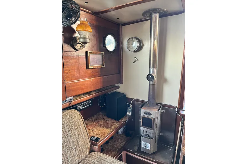 Slide: The Image of Interior of 1943 Shain-Monk cruiser with wood paneling and vintage stove. - 7