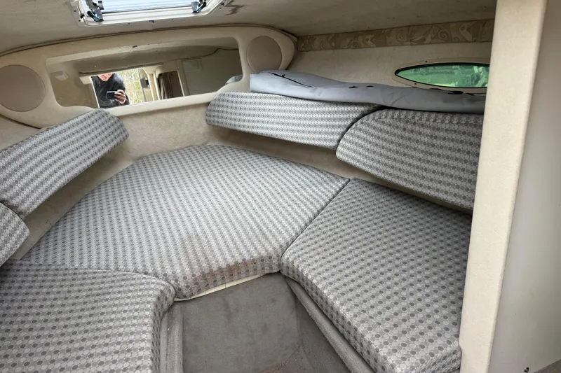 Slide: The Image of Interior cabin of a 2004 Sea Ray 215 Weekender with patterned cushions. - 17