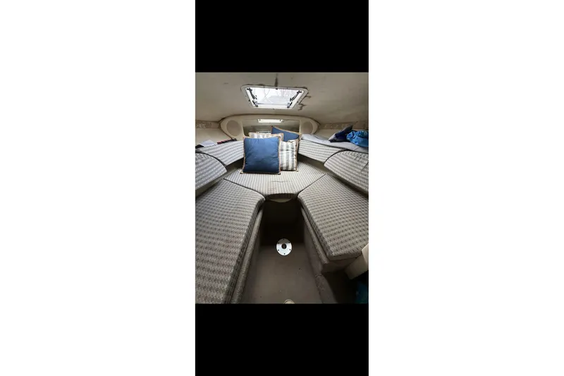Slide: The Image of Interior cabin of 2004 Sea Ray 215 Weekender with cushions and pillows. - 4
