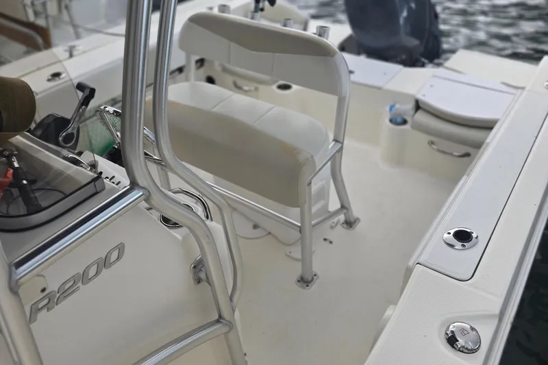 Slide: The Image of 2015 Robalo R200 Center Console boat interior with seating and control panel. - 11