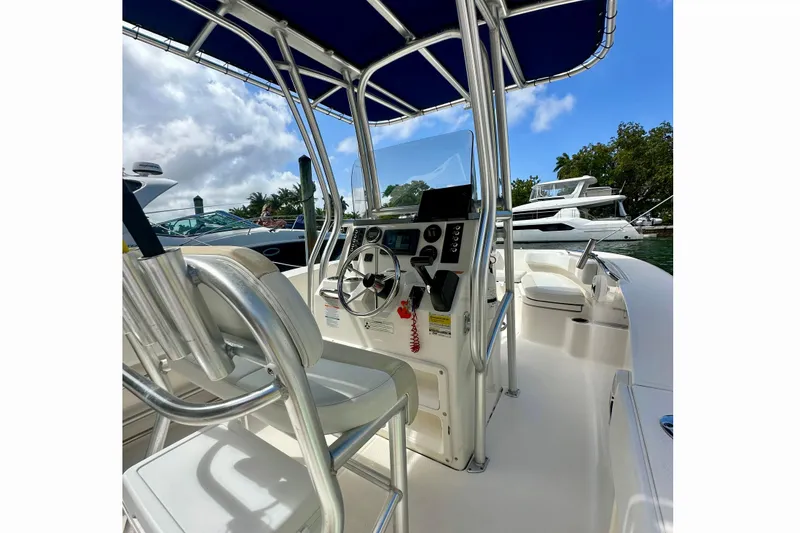 Slide: The Image of 2015 Robalo R200 Center Console boat interior with steering wheel and seating. - 8