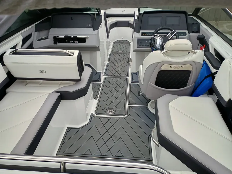 Slide: The Image of Luxurious interior of a 2022 Cobalt R4 boat with modern seating and dashboard. - 2