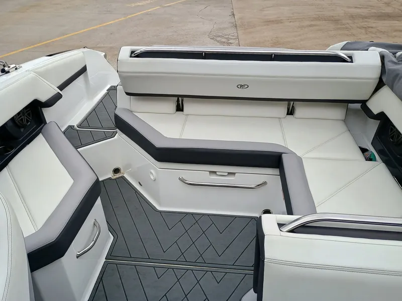 Slide: The Image of 2022 Cobalt R4 boat interior with white and gray seating and sleek design. - 3