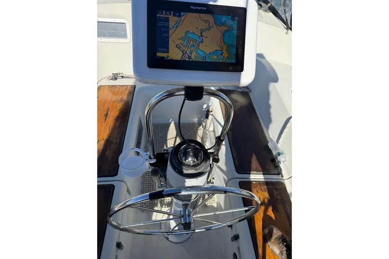 Slide: The Image of Cockpit of 1985 Jouet 950 sailboat with navigation system and steering wheel. - 3