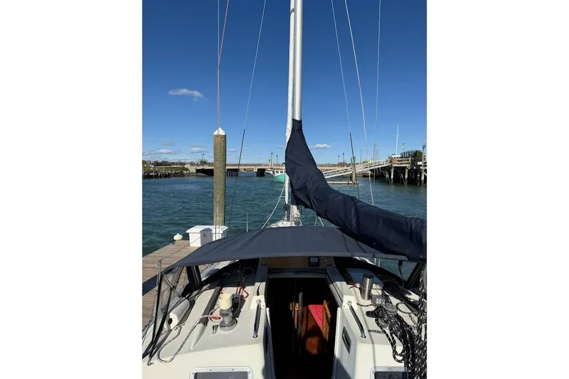Slide: The Image of Sailboat docked at marina, Jouet 950 model, 1985, under clear blue sky. - 5