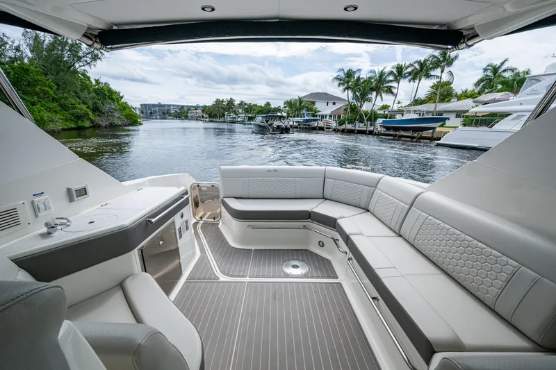Slide: The Image of Luxurious 2023 Sea Ray Sundancer 320 Outboard interior with waterfront view. - 42