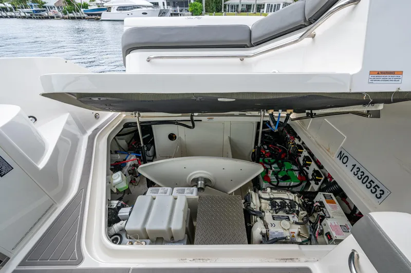 Slide: The Image of 2023 Sea Ray Sundancer 320 Outboard engine compartment, showcasing detailed mechanical components. - 45