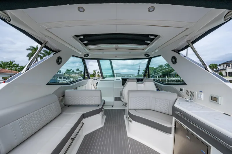 Slide: The Image of Luxurious interior of 2023 Sea Ray Sundancer 320 Outboard, featuring sleek seating and modern amenities. - 46