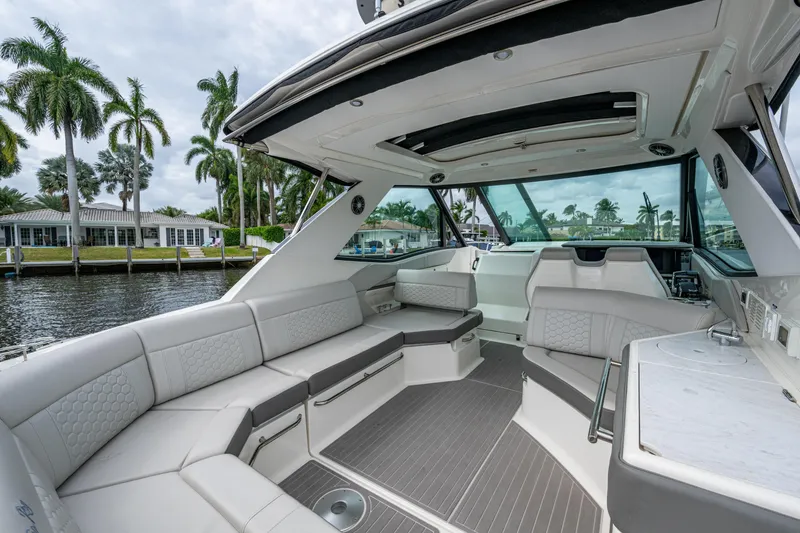 Slide: The Image of 2023 Sea Ray Sundancer 320 Outboard interior with luxurious seating and modern design. - 47